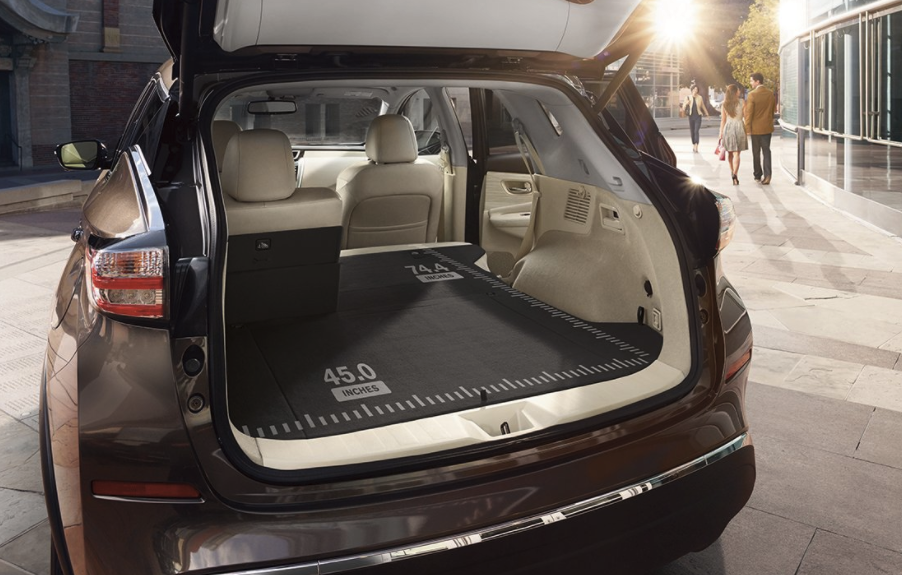 The back area of a 2017 Nissan Murano with one of the second row seats folded down, and the dimensions marked on the surface. 