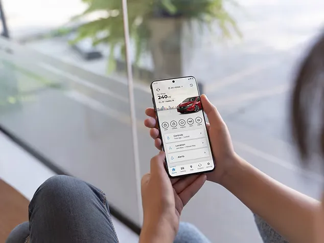 NissanConnect Remote Access Mobile App Interface NissanConnect mobile app showing remote vehicle features on smartphone