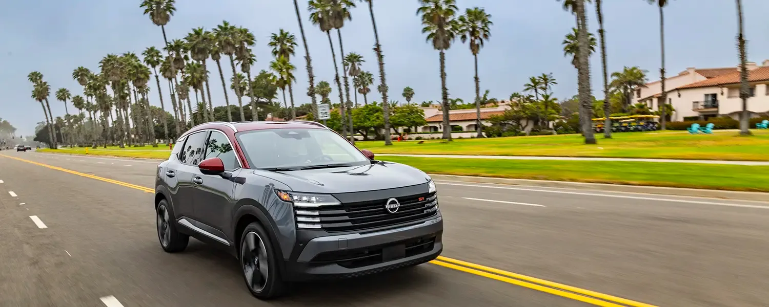 Gray and red 2026 Nissan Kicks SR crossover with black wheels and SR badging
