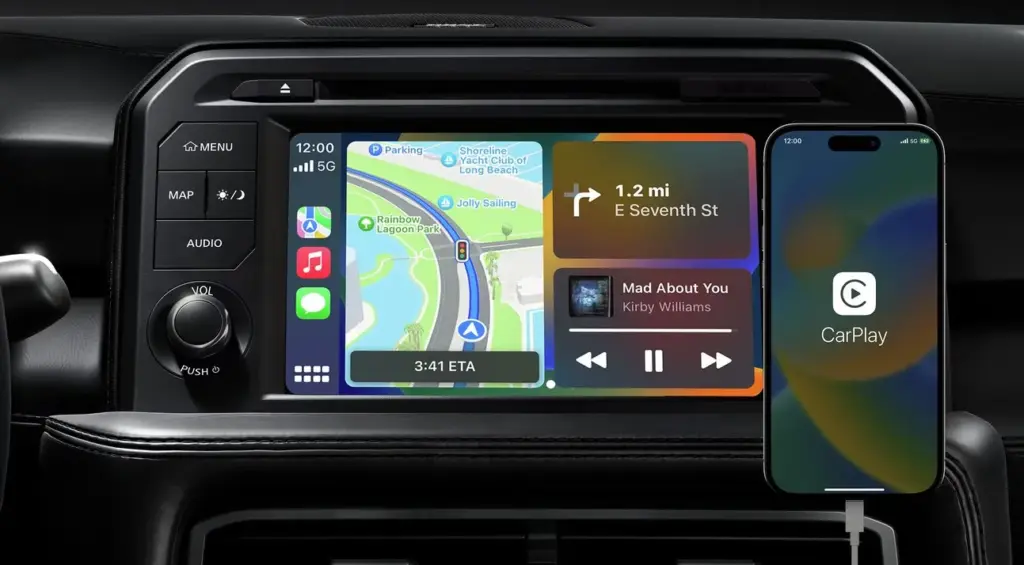 Apple CarPlay Infotainment Display With Navigation and Audio In-dash infotainment screen showing Apple CarPlay navigation and music interface