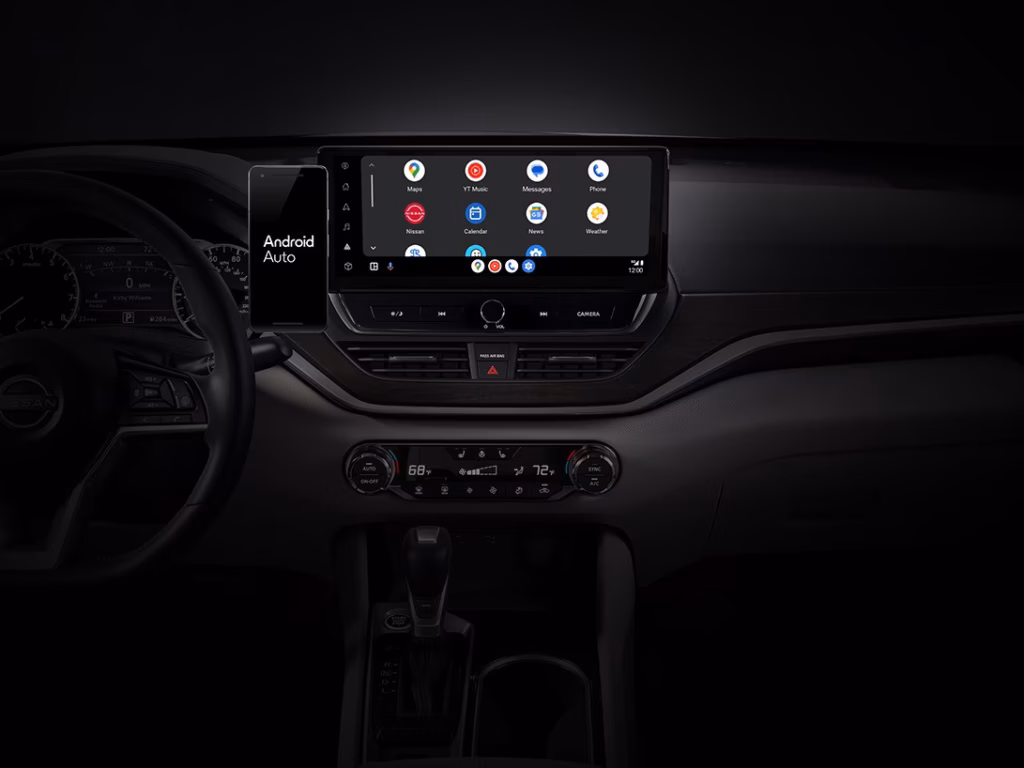 Nissan Dashboard with Android Auto Infotainment System Display Nissan dashboard with touchscreen display showing Android Auto interface and connected smartphone
