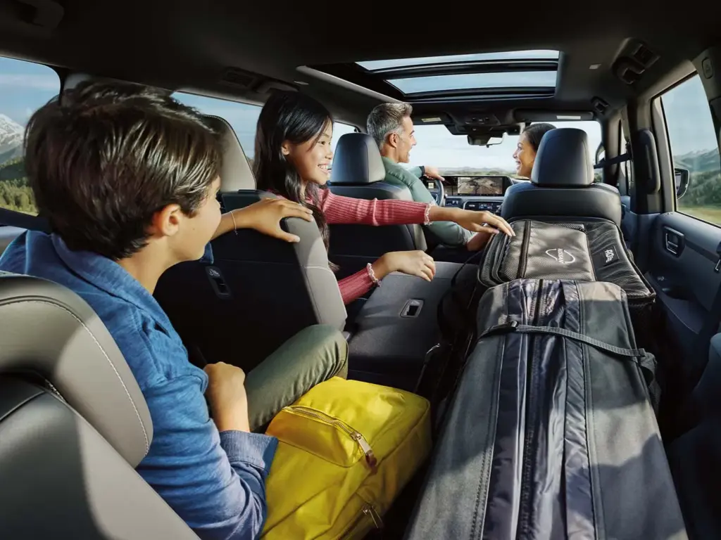 Nissan Armada Family Road Trip Interior Space Family riding inside Nissan Armada with spacious seating and cargo