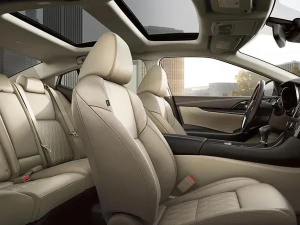 Nissan Beige Leather Interior Seats Beige leather front and rear seats inside Nissan vehicle