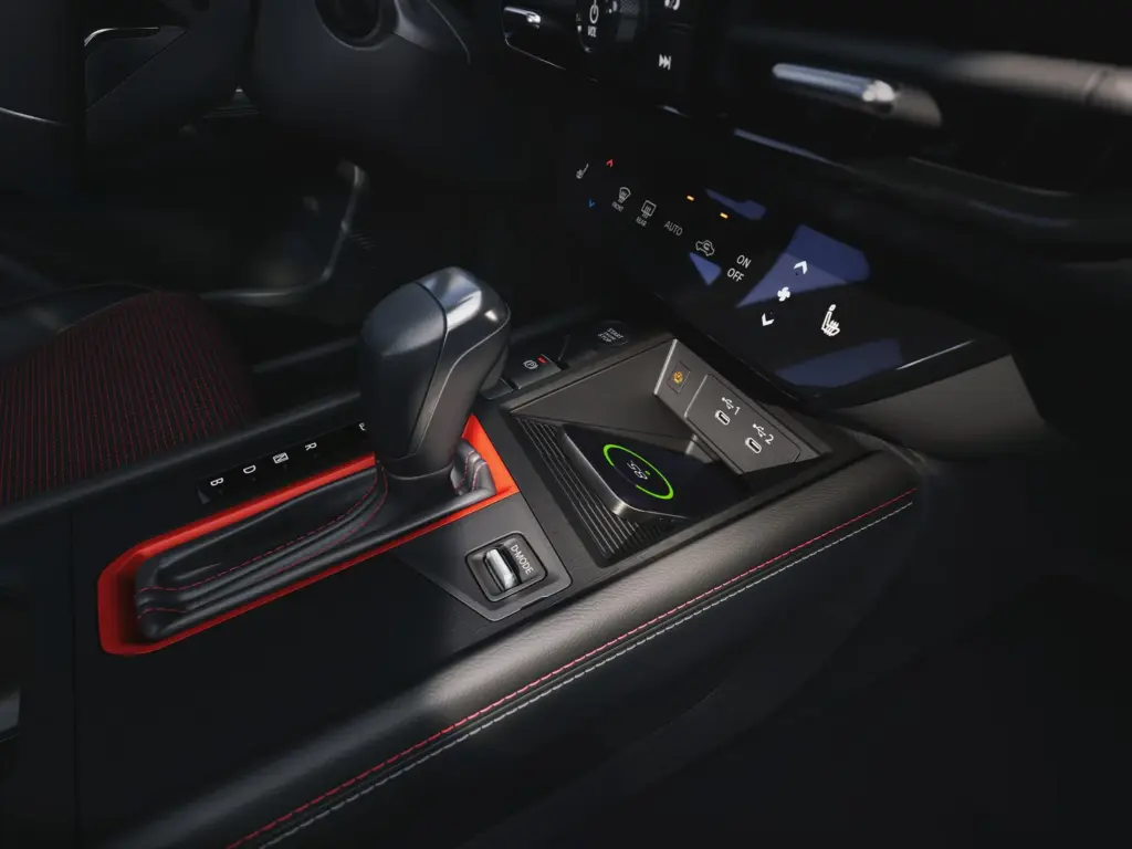 Nissan Center Console with Gear Selector and Wireless Charging Center console with gear selector, wireless charging pad, USB ports, and climate control buttons