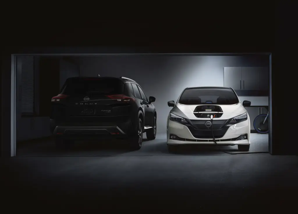 Nissan Leaf Charging Beside Nissan Rogue Nissan Leaf charging in garage next to Nissan Rogue