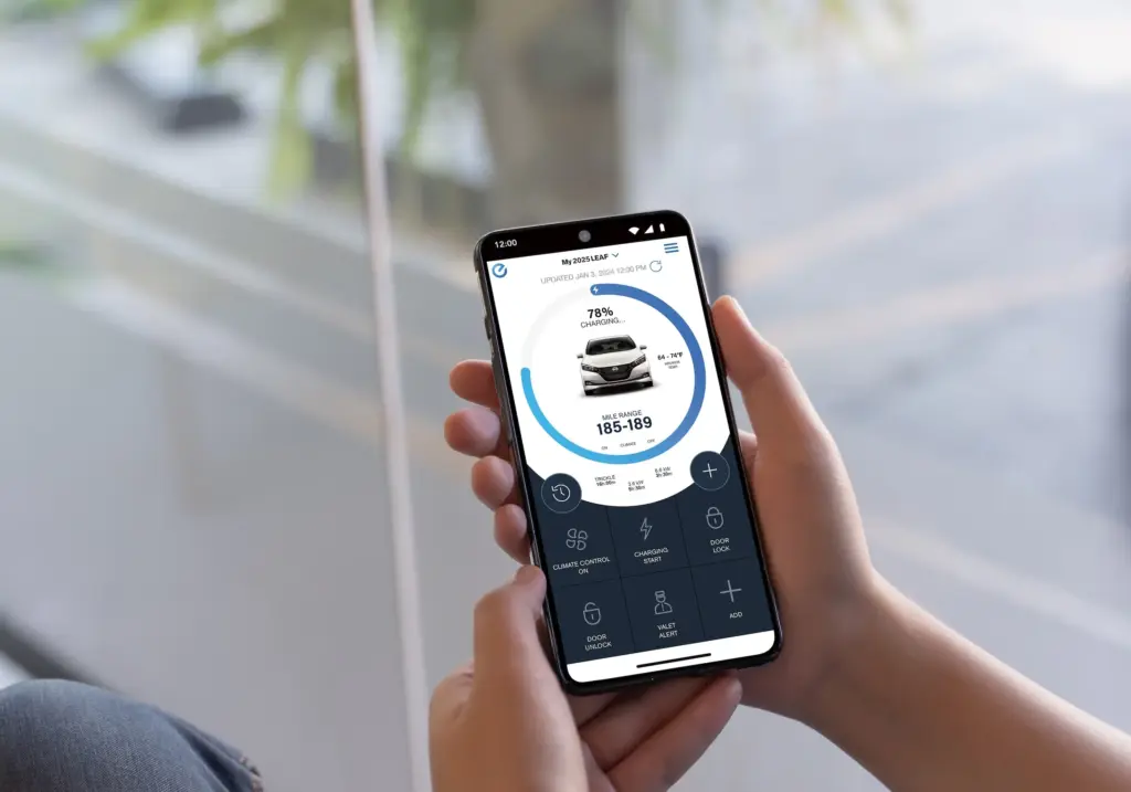 Nissan Leaf Mobile App Battery and Charging Status Hand holding smartphone showing Nissan Leaf charging status