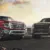 Two Nissan Titan trucks parked on mountain road