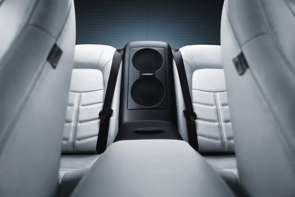 Bose Audio Speakers Integrated Into Rear Seat Center Console Rear seat center console with integrated Bose audio speakers between leather seats