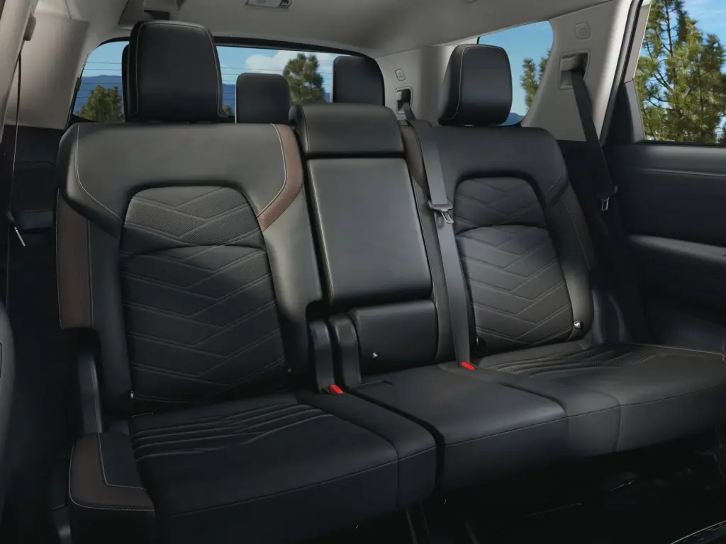 Rear SUV Black Leather Seats Interior Rear row of black leather seats inside an SUV with seat belts visible