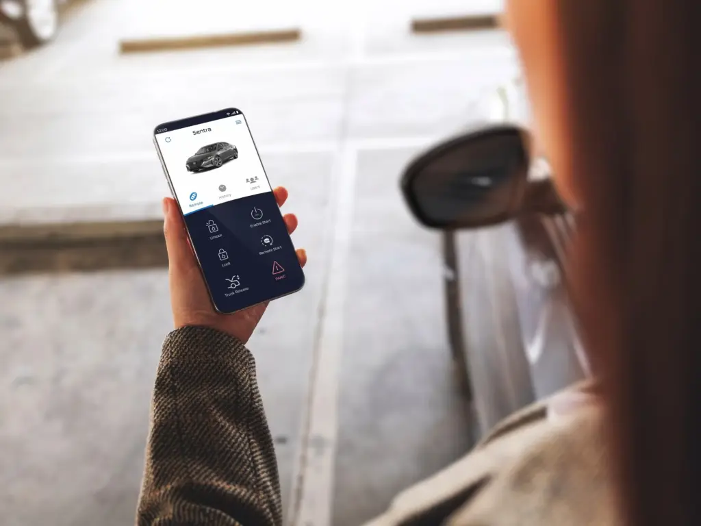 Remote Car Control Using Mobile App Person using mobile app to control car remotely