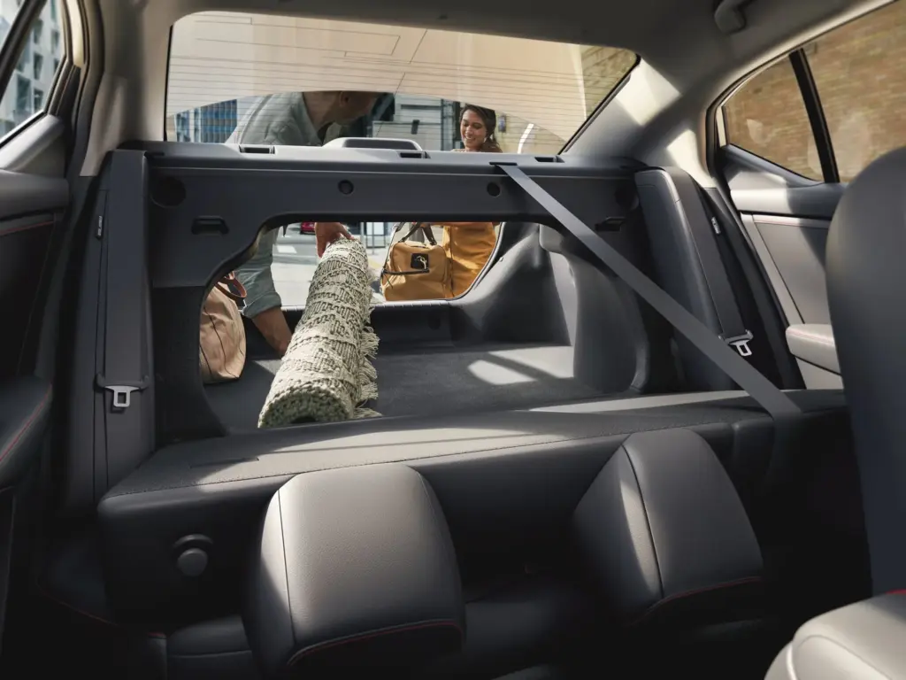 Sedan Folding Rear Seats for Cargo Space Rear seats folded to create extra cargo space in sedan